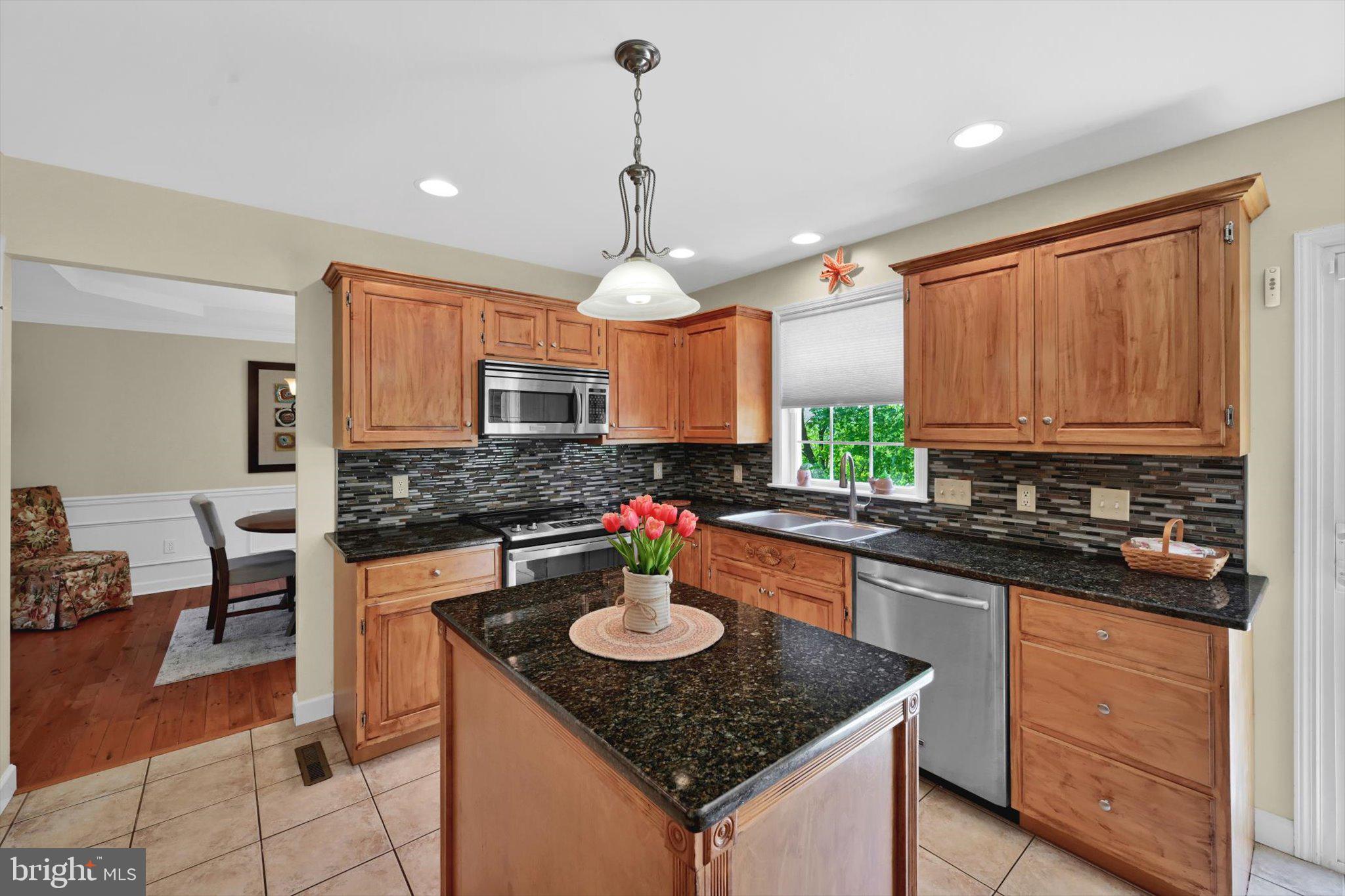 624 Stoney Run Road Pottsville, PA 17901 - Photo 10 of 40 a kitchen with a stove a sink dishwasher a kitchen island with wooden cabinets and floor