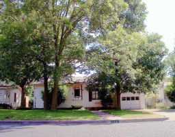 2507 Addison Avenue Austin, TX 78757 - Photo 1 of 1 a front view of a house with a garden and tree