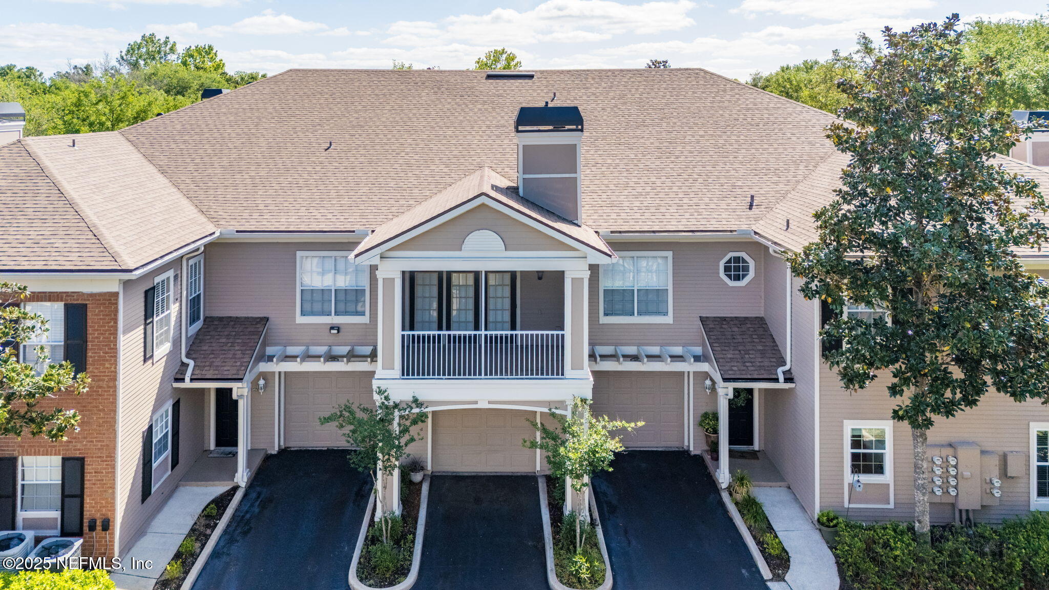 10901 Burnt Mill Road, Unit 2204 Jacksonville, FL 32256 - Photo 39 of 49 a front view of a house with garden