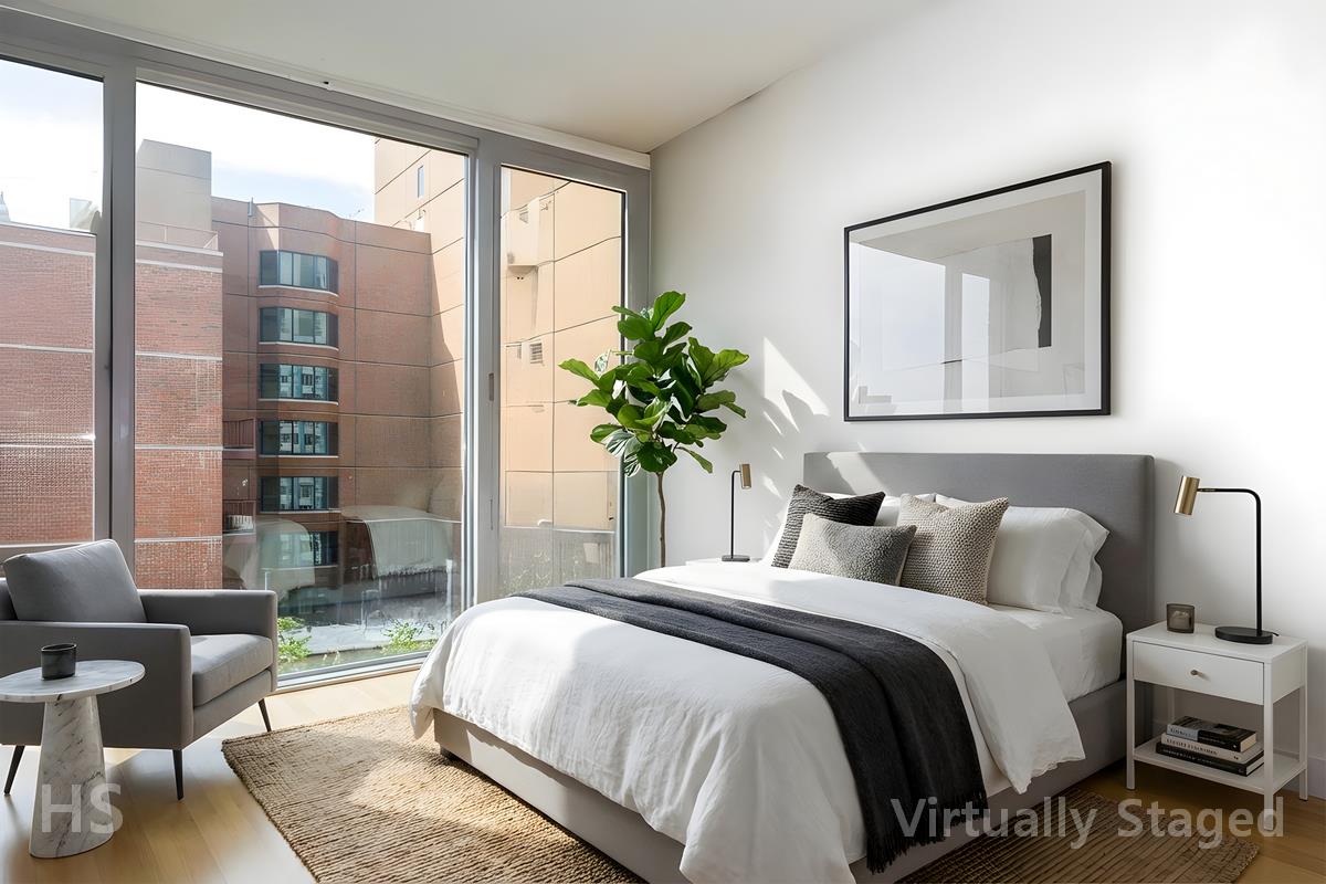 110 3rd Avenue, Unit 9A Manhattan, NY 10003 - Photo 8 of 13 a bedroom with a large bed and a potted plant