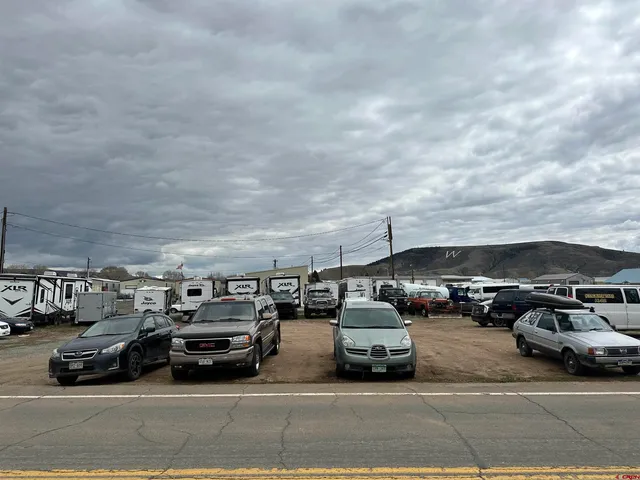 a view of parking with cars parked