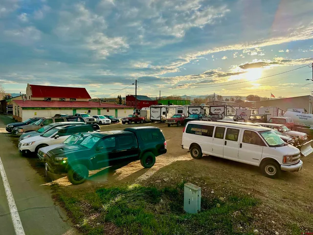 a view of parking space with cars parked