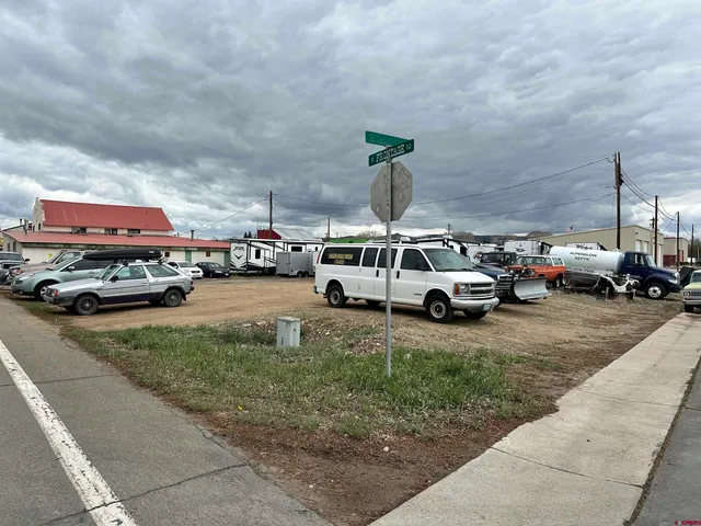 a view of cars parked in front of a building