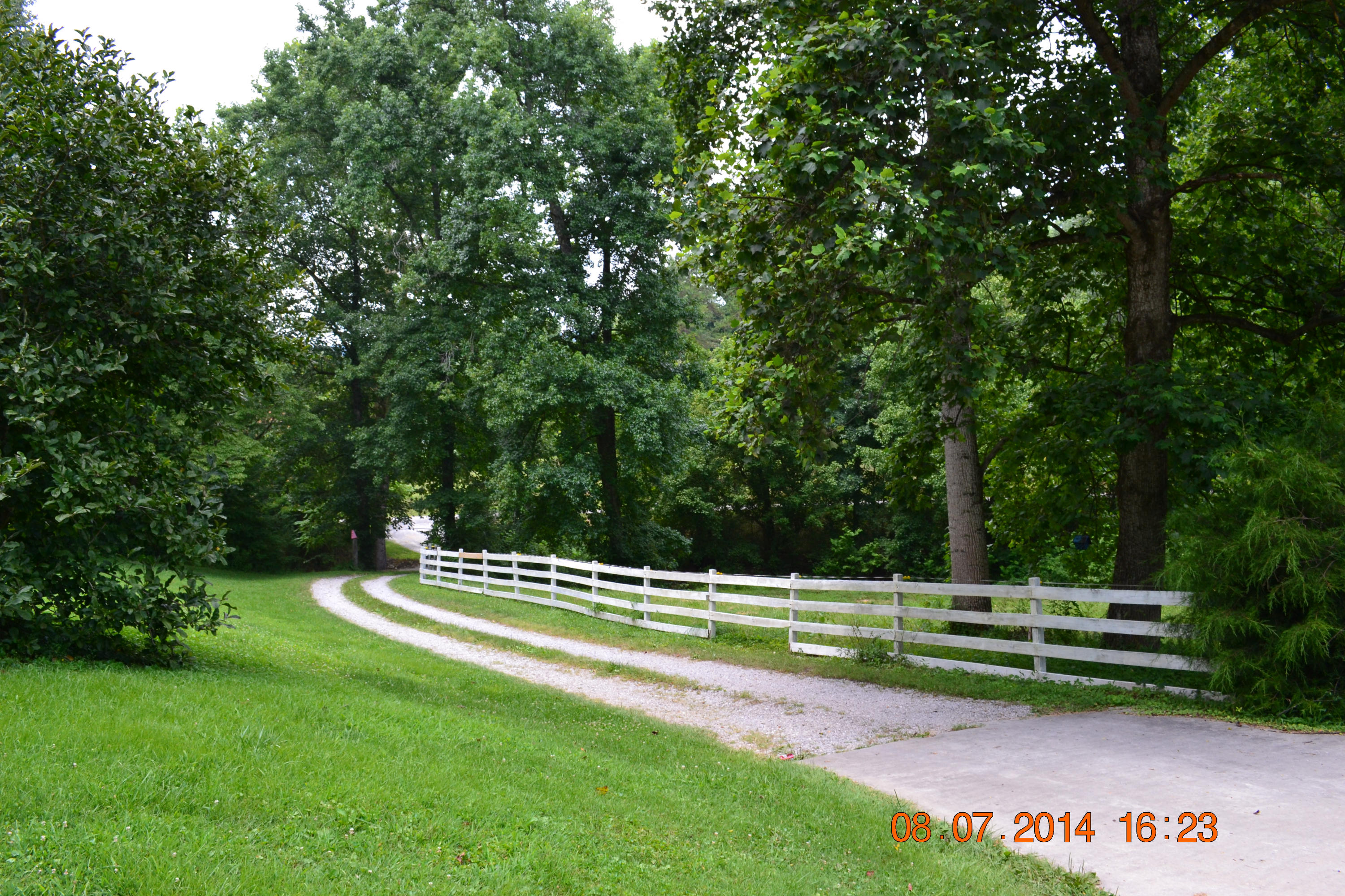 608 Webster Road Harriman, TN 37748 - Photo 32 of 37 Looking down driveway and fence