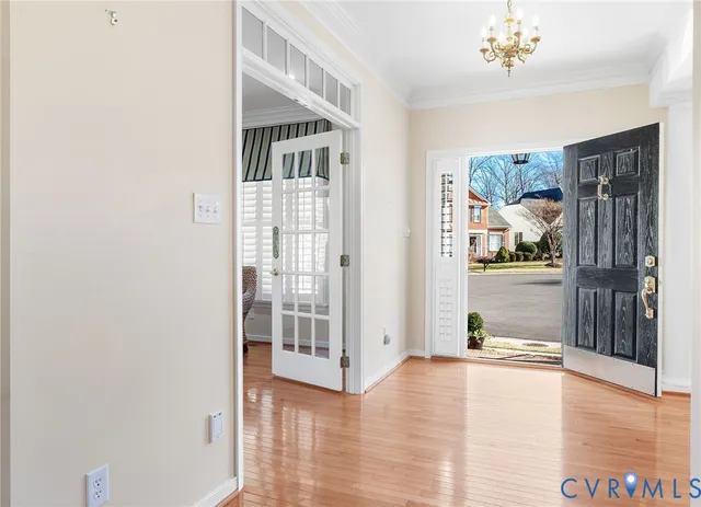a view of an entryway with wooden floor