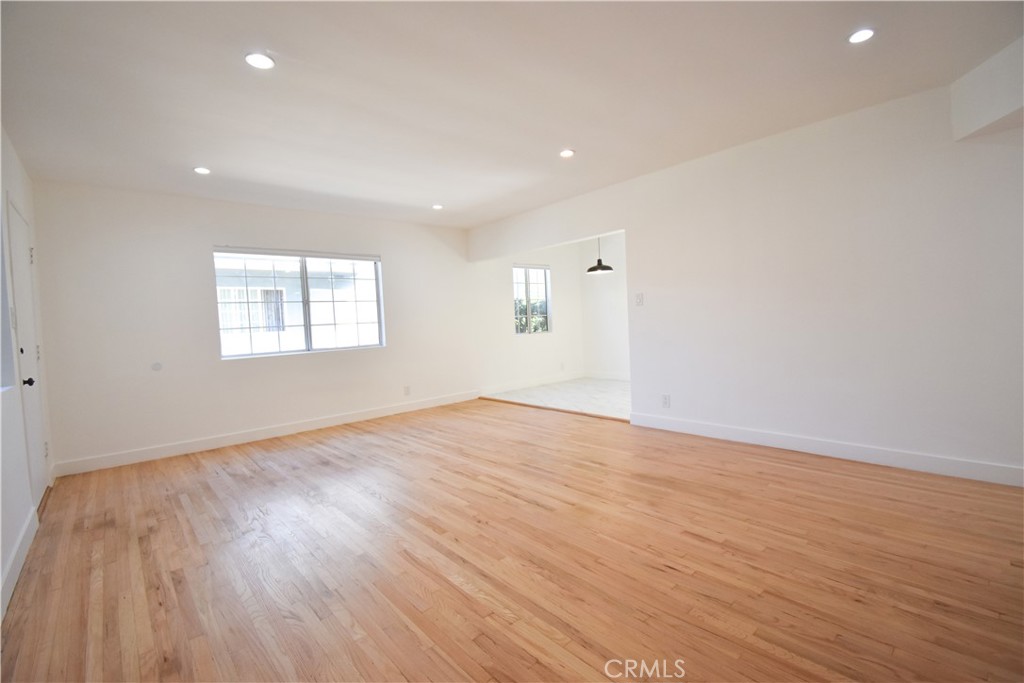 1570 North Verdugo Road, Unit B Glendale, CA 91208 - Photo 7 of 12 an empty room with wooden floor and windows