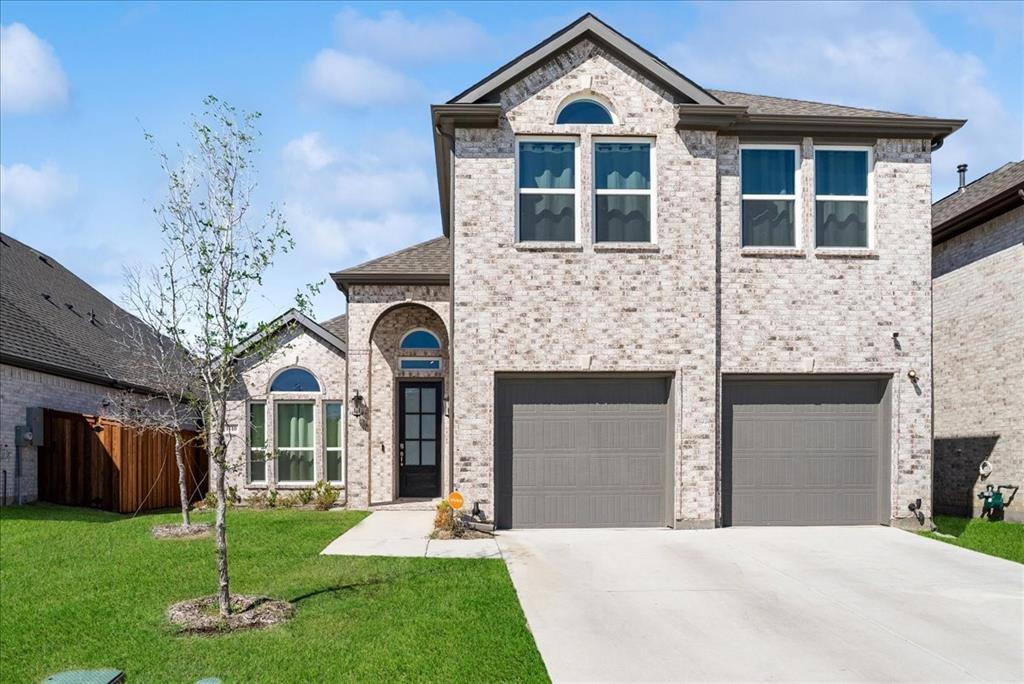 1710 Highwood Road Forney, TX 75126 - Photo 25 of 25 Two-story brick exterior with a two-car garage, arched entryways, and multiple windows