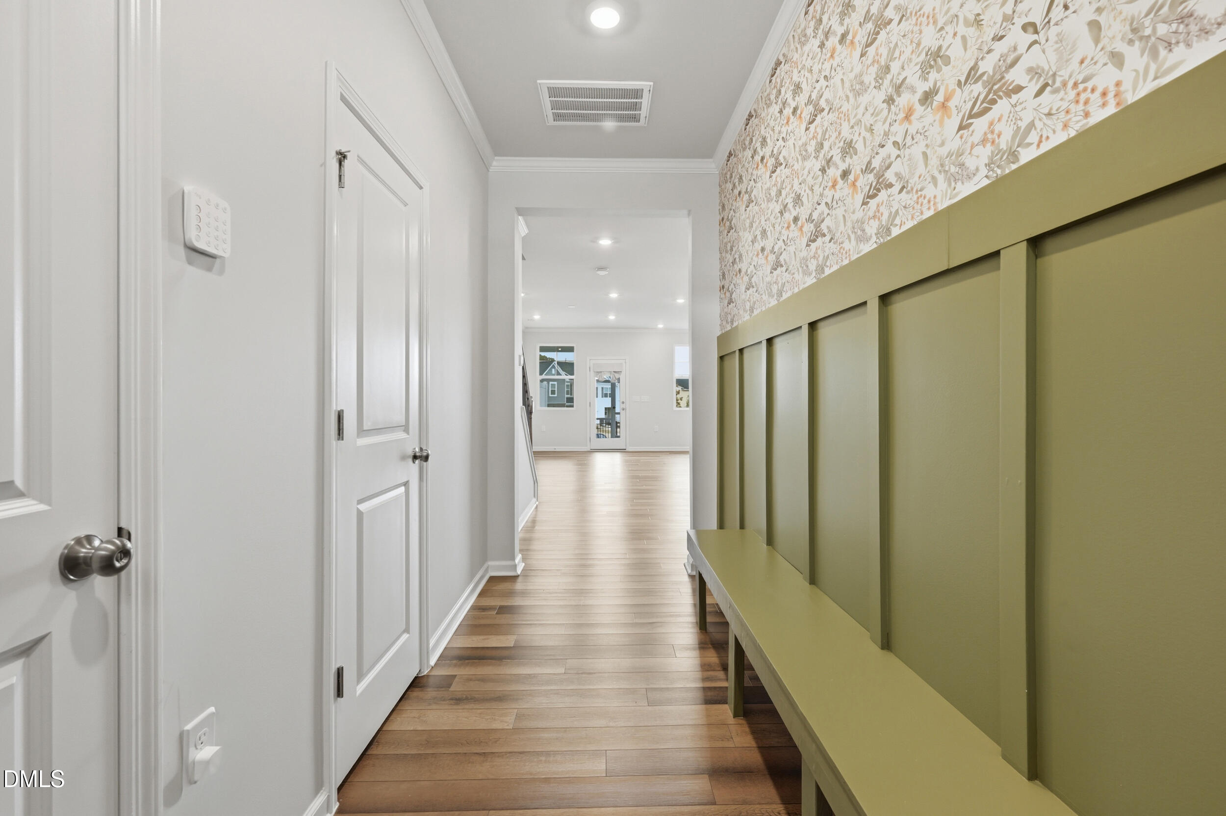 5011 Kota Street Raleigh, NC 27610 - Photo 2 of 42 a view of a hallway with wooden floor and staircase