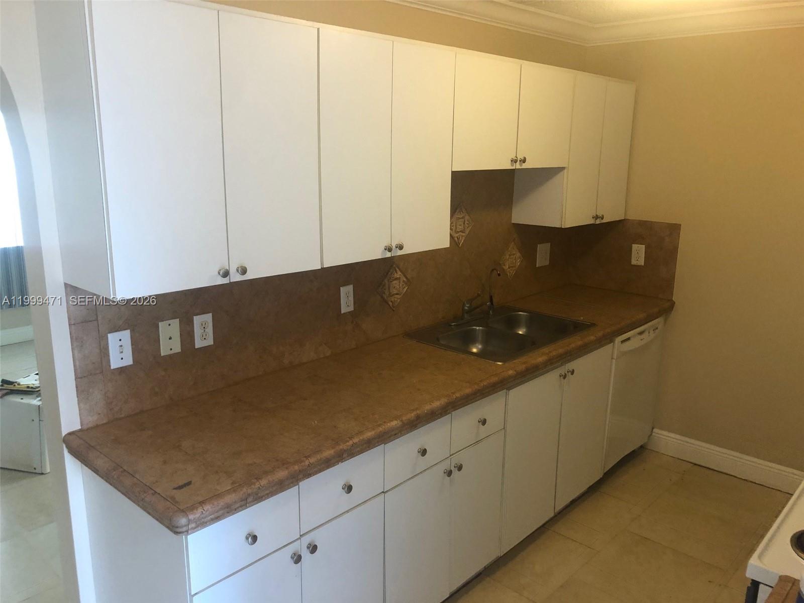 12787 Southwest 257th Street, Unit 12787 Homestead, FL 33032 - Photo 3 of 5 a view of cabinets