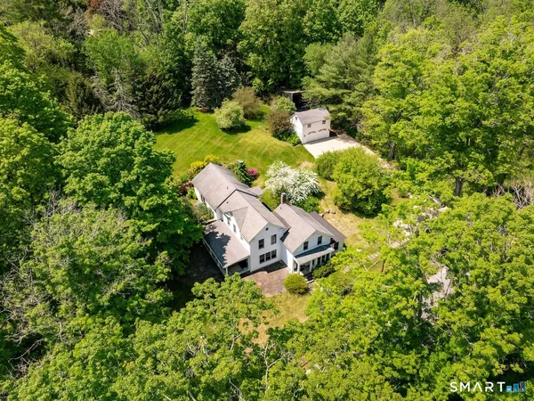 a aerial view of a house with a yard