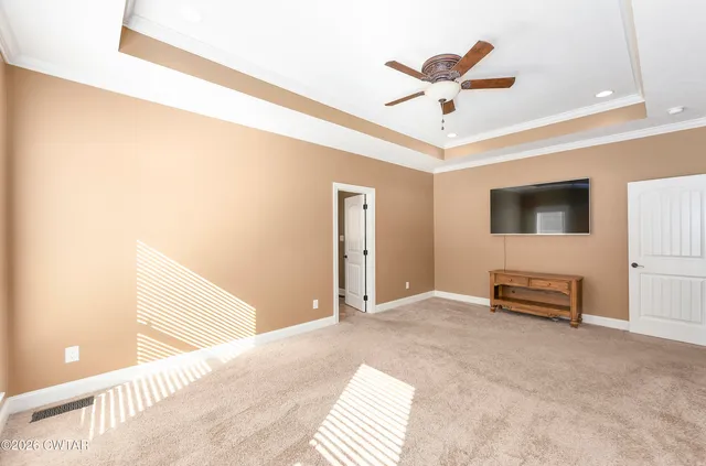 a view of livingroom with hardwood and ceiling fan