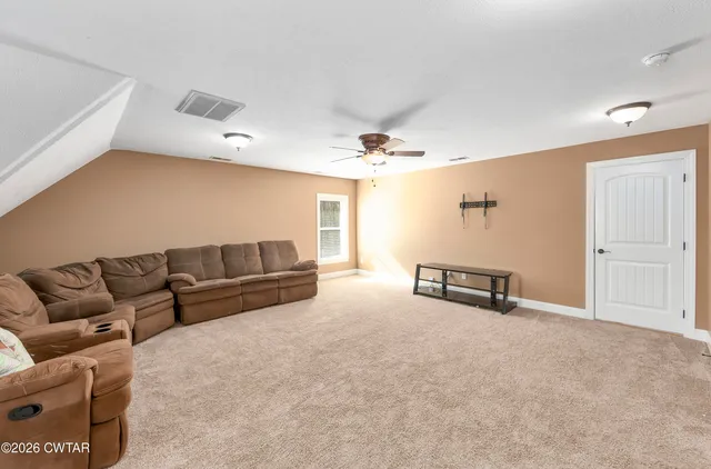 a living room with furniture and a couch