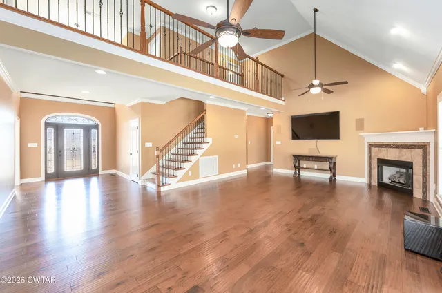 a view of an entryway with wooden floor