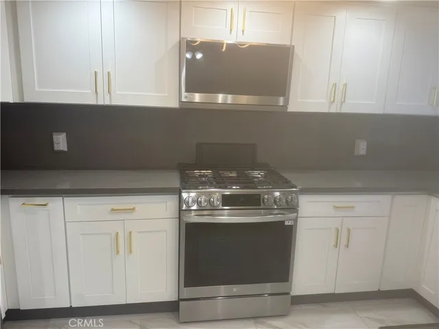 a bathroom with a double vanity sink and mirror