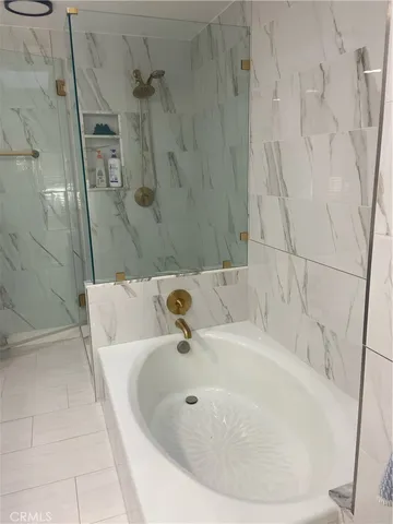 a kitchen with stainless steel appliances granite countertop a refrigerator sink and stove