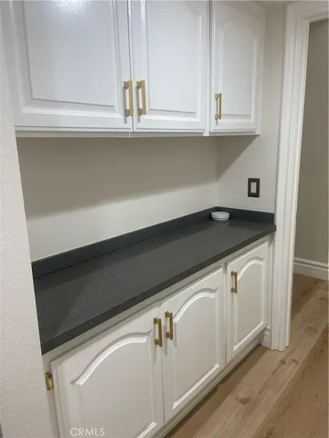 a view of kitchen sink window and cabinets