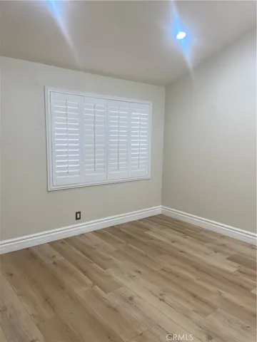 a view of balcony with wooden floor