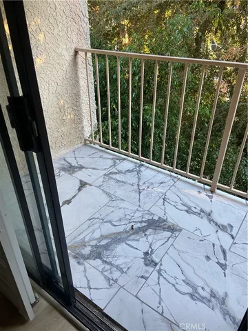 a view of potted plant in front of a door