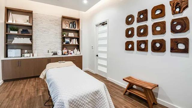 a view of a sign board with a park table and chairs