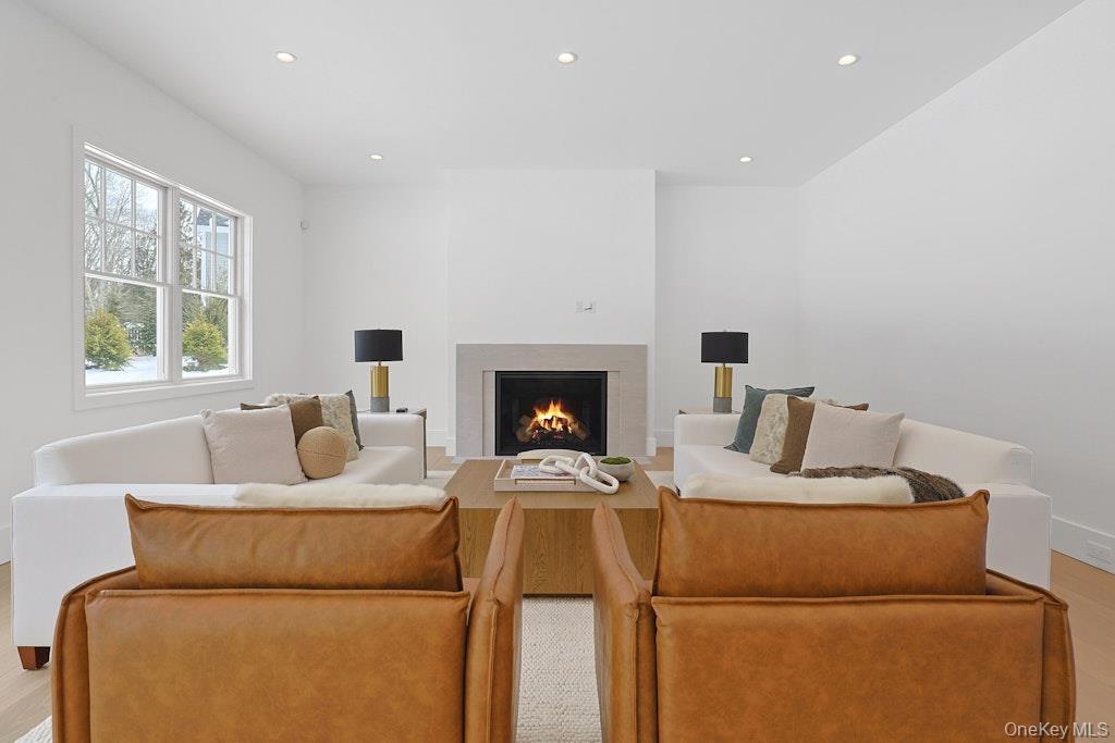 86 Old Byram Lake Road Armonk, NY 10504 - Photo 19 of 44 a living room with furniture and a fireplace