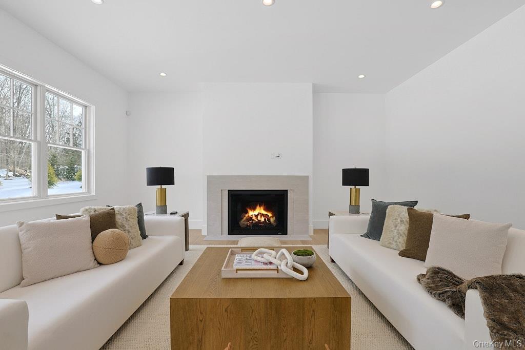 86 Old Byram Lake Road Armonk, NY 10504 - Photo 20 of 44 a living room with furniture and a fireplace
