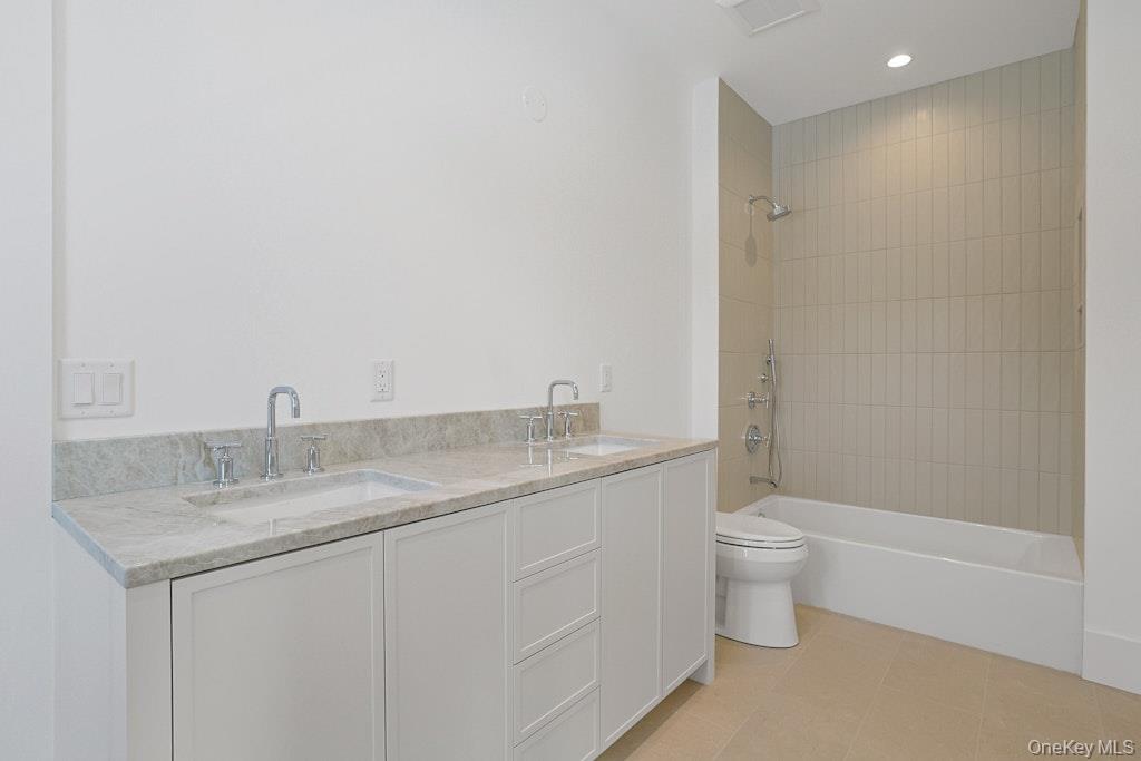 86 Old Byram Lake Road Armonk, NY 10504 - Photo 37 of 44 a bathroom with a granite countertop sink a toilet and shower