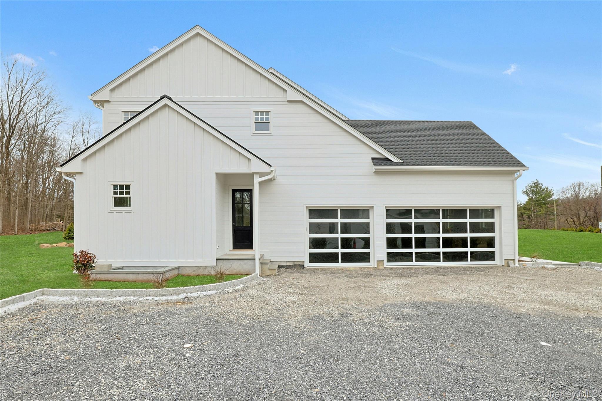 86 Old Byram Lake Road Armonk, NY 10504 - Photo 41 of 44 a view of a house with a yard and garage