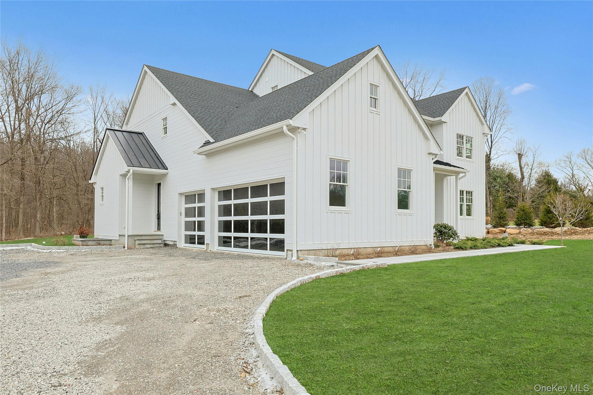 86 Old Byram Lake Road Armonk, NY 10504 - Photo 42 of 44 a front view of a house with a yard