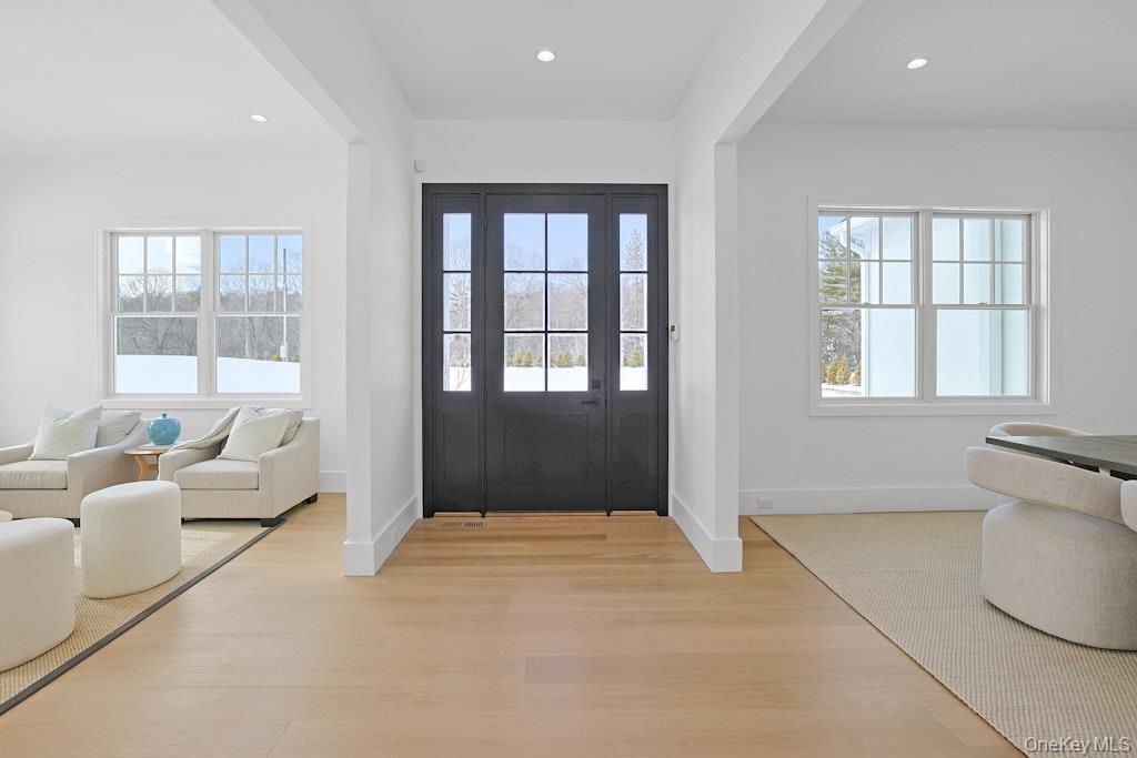 86 Old Byram Lake Road Armonk, NY 10504 - Photo 7 of 44 a spacious bedroom with a large bed and a couch