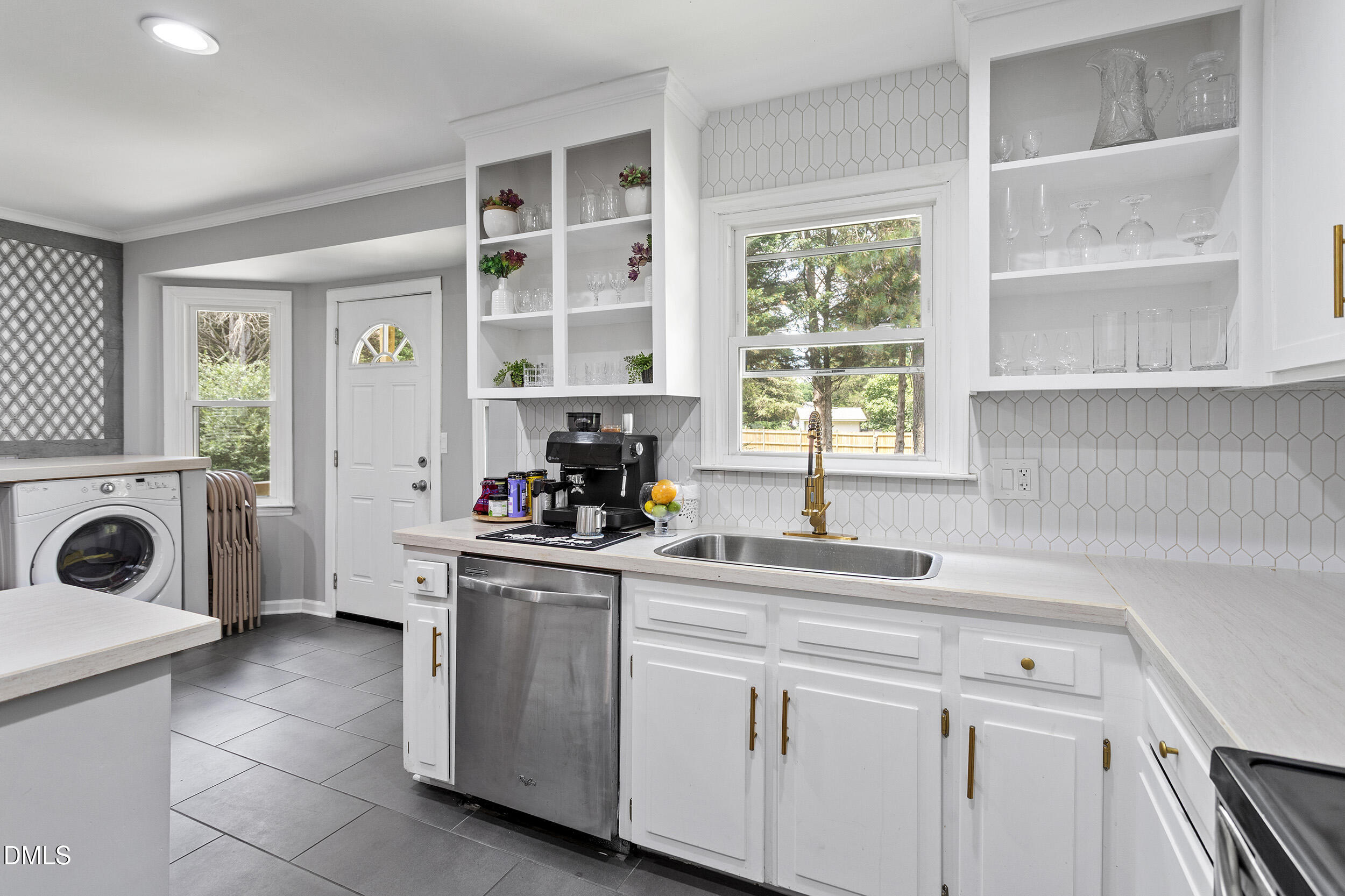 5809 Iris Lake Court Raleigh, NC 27604 - Photo 11 of 29 a kitchen with a sink a stove and cabinets