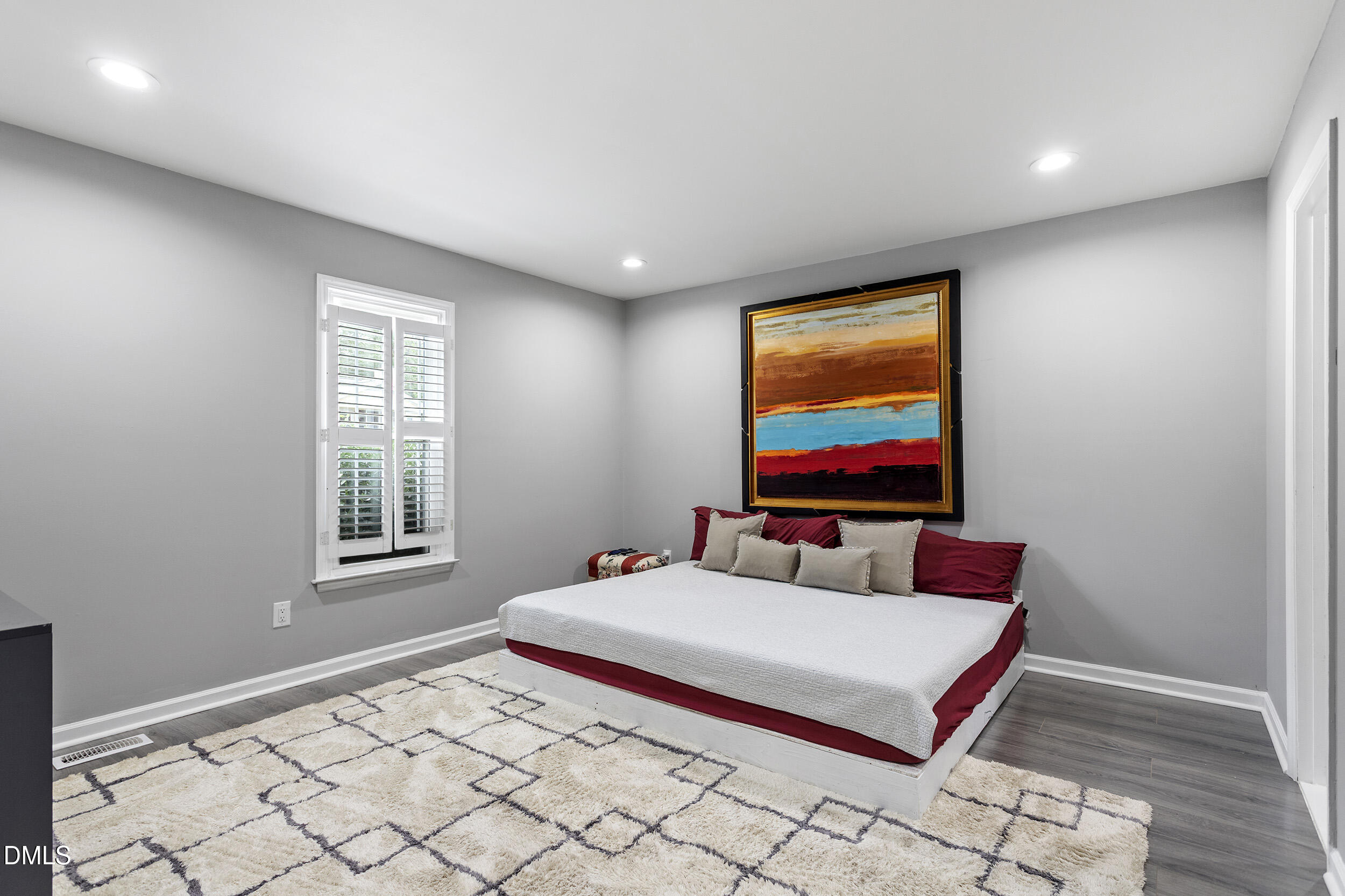5809 Iris Lake Court Raleigh, NC 27604 - Photo 20 of 29 a living room with a rug and a flat screen tv