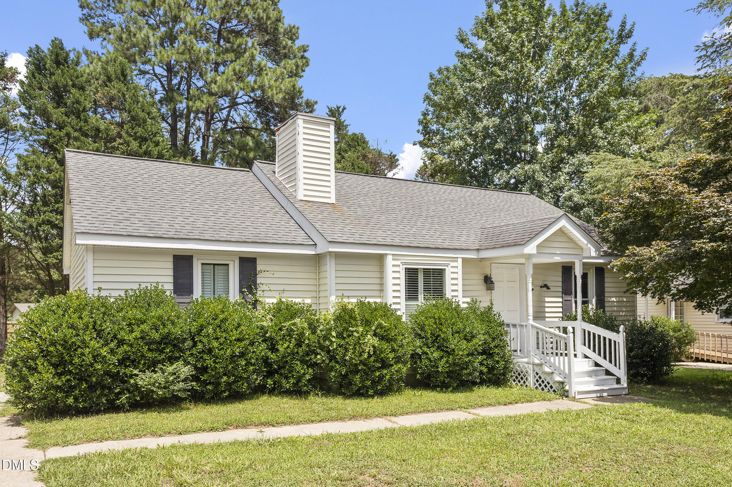 5809 Iris Lake Court Raleigh, NC 27604 - Photo 2 of 29 a house that has a tree in front of the house