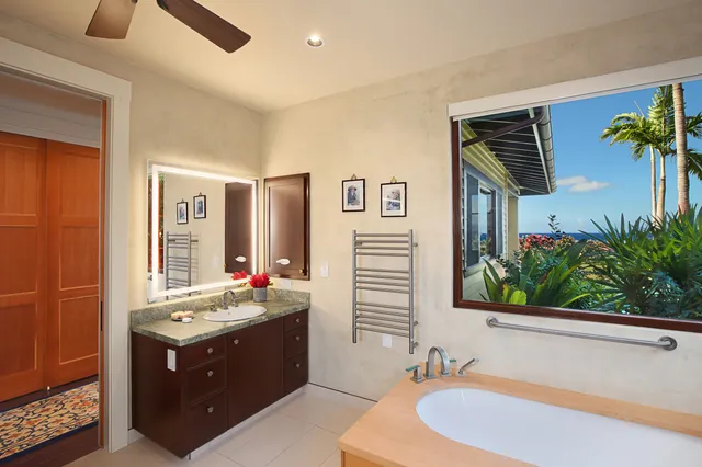 a bathroom with a sink double vanity and a mirror