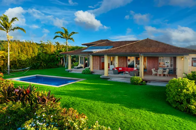 a view of a house with a tree