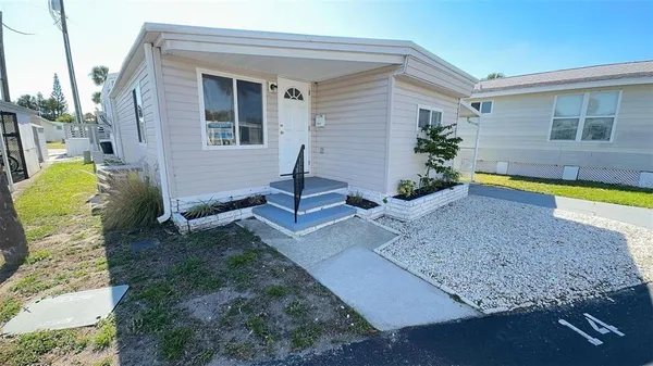 a house view with a backyard space