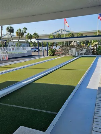 a view of swimming pool with outdoor seating