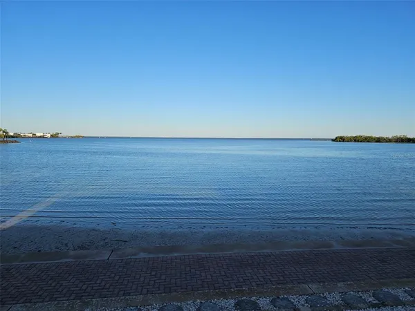 a view of ocean with sunset