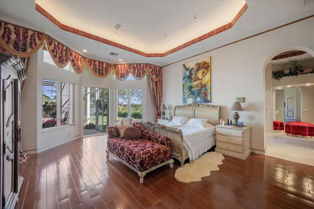 a bathroom with a bathtub shower sink and mirror