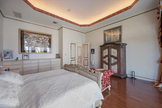 a bedroom with a bed and glass window