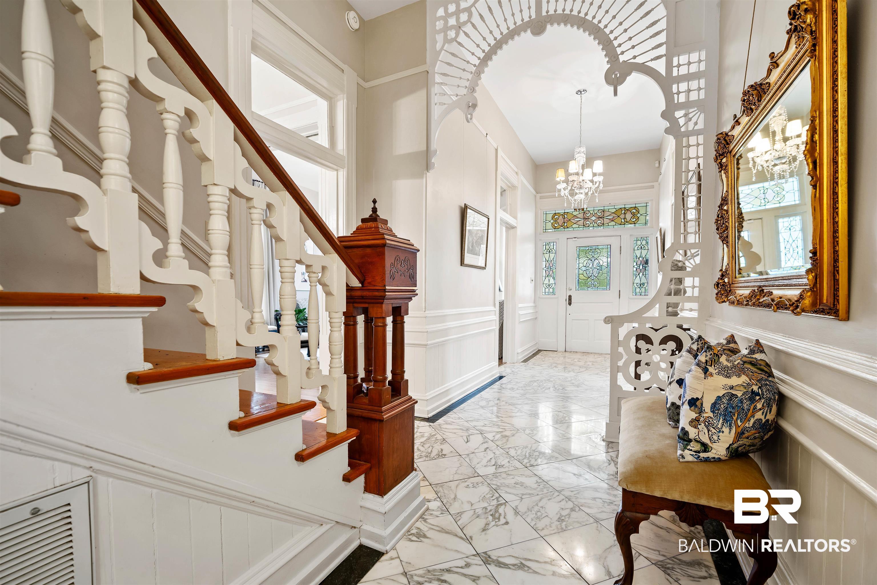1314 Dauphin Street Mobile, AL 36604 - Photo 12 of 61 Entrance foyer with plenty of natural light and a chandelier
