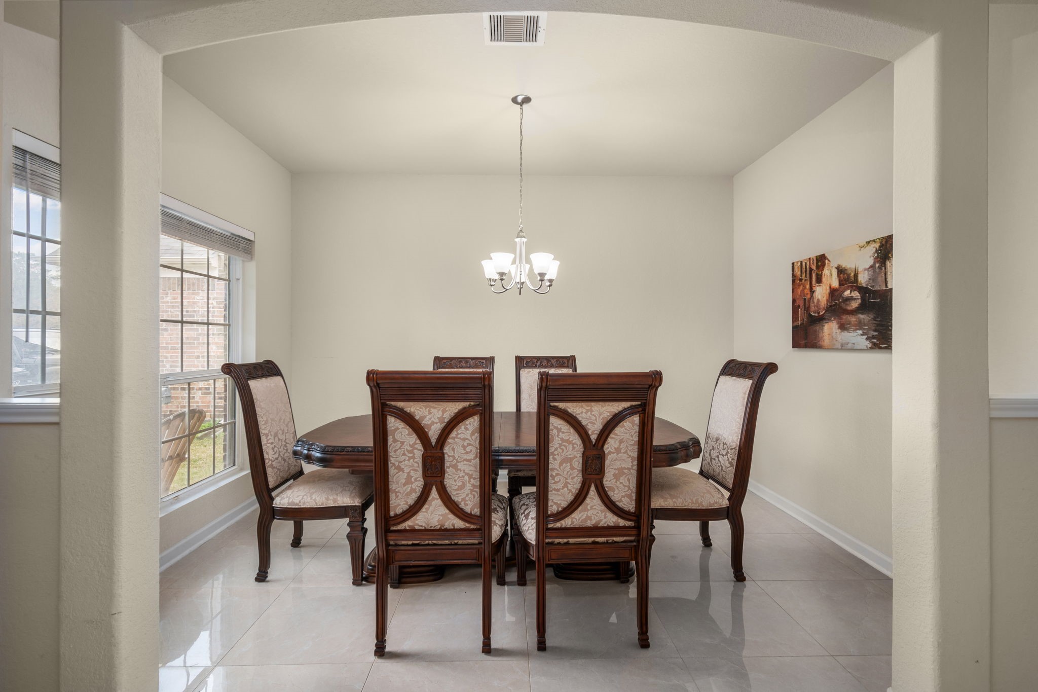 2702 Elm Crossing Trail Spring, TX 77386 - Photo 8 of 21 a view of a dining room with furniture and chandelier