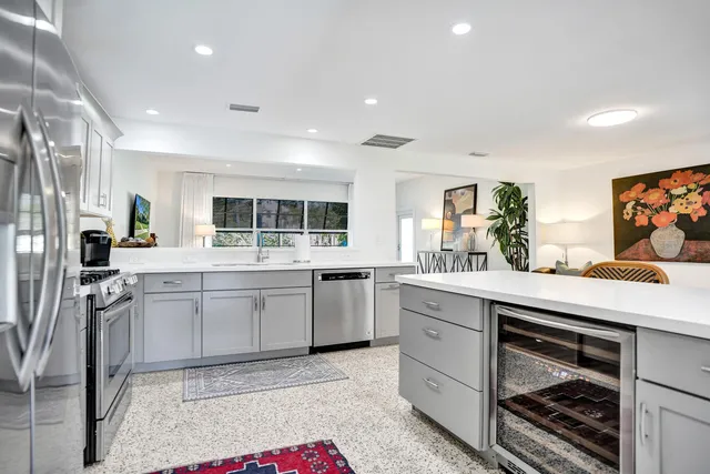 a kitchen with sink and cabinets