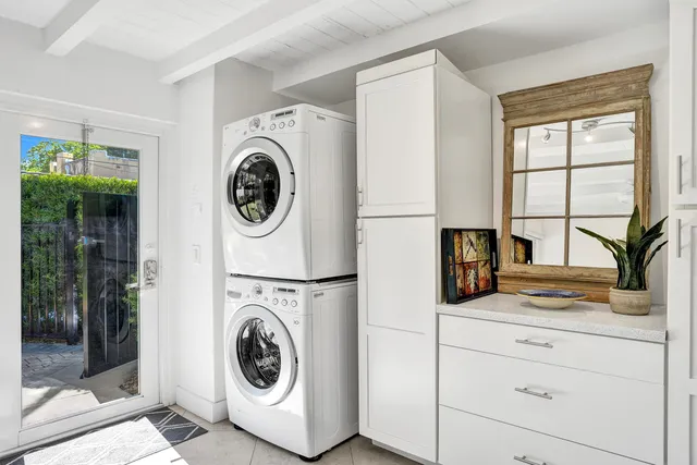 a utility room with sink dryer and washer