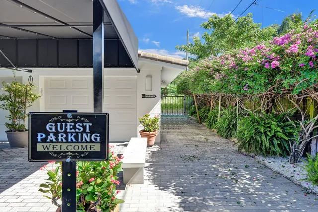 a view of a pathway house a garden