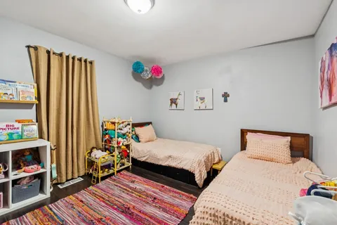 a bedroom with bed and a closet