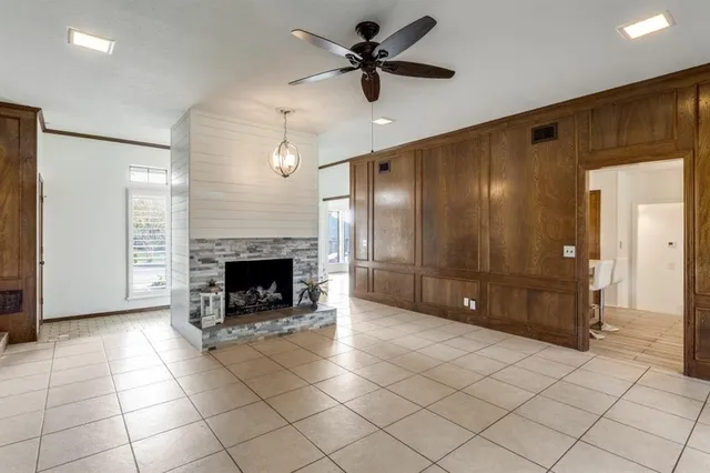 a view of an empty room with a fireplace