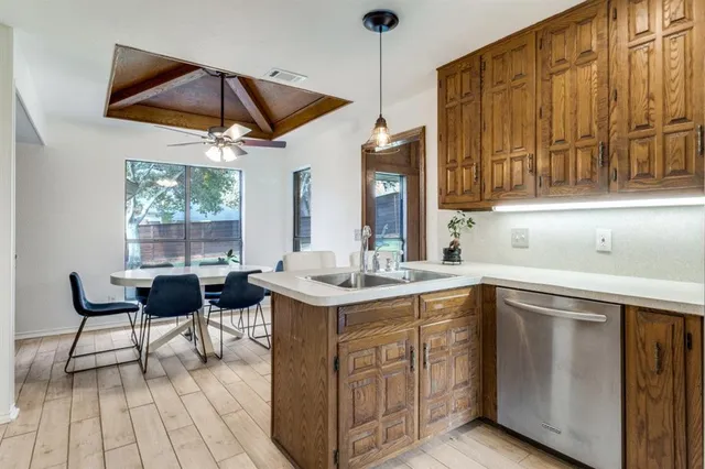a kitchen with a sink and cabinets