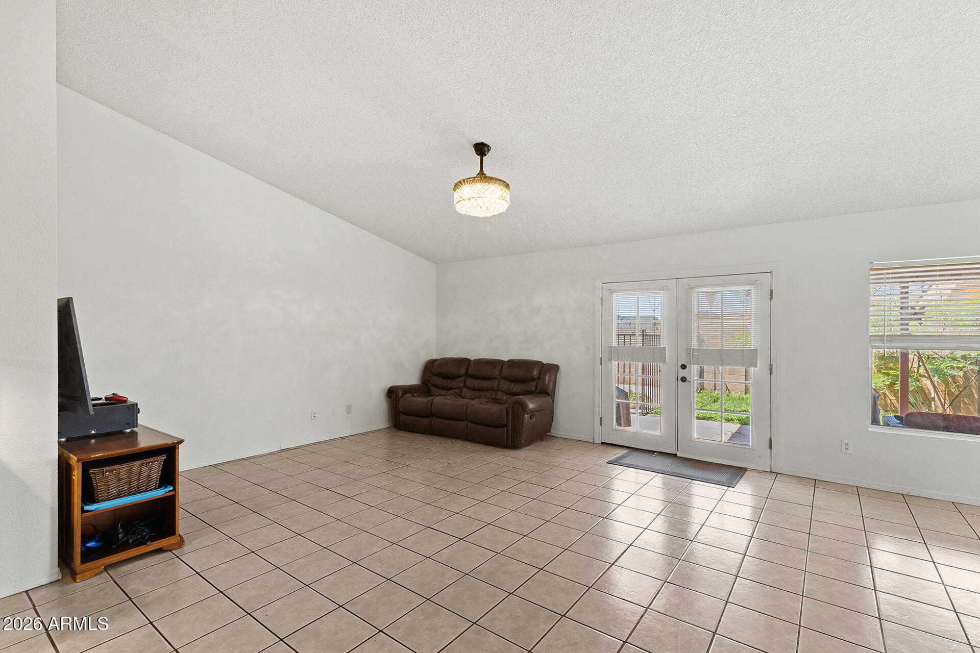 9002 West Coronado Road Phoenix, AZ 85037 - Photo 4 of 54 a living room with furniture and a window