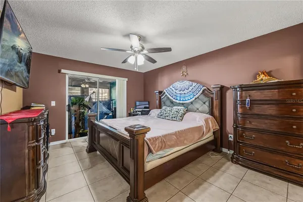 a bed room with a bed and a chandelier
