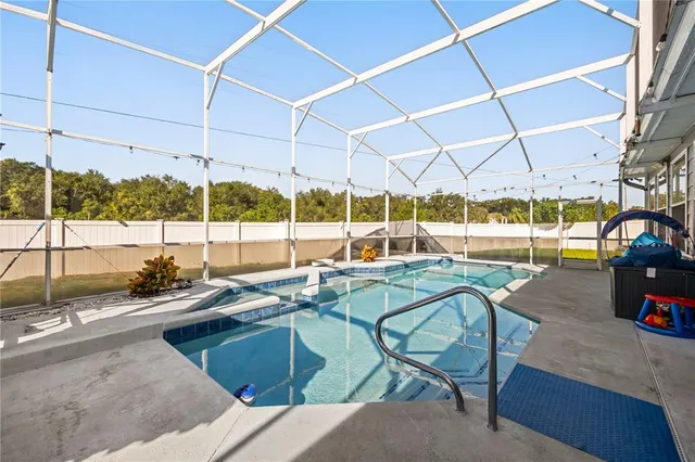a view of a swimming pool with a patio